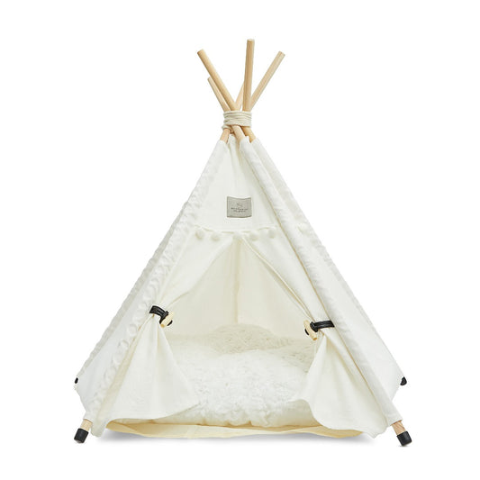 Denali teepee cat bed white with thick, soft cushion, floor protectors, wooden poles, and tieback curtains.