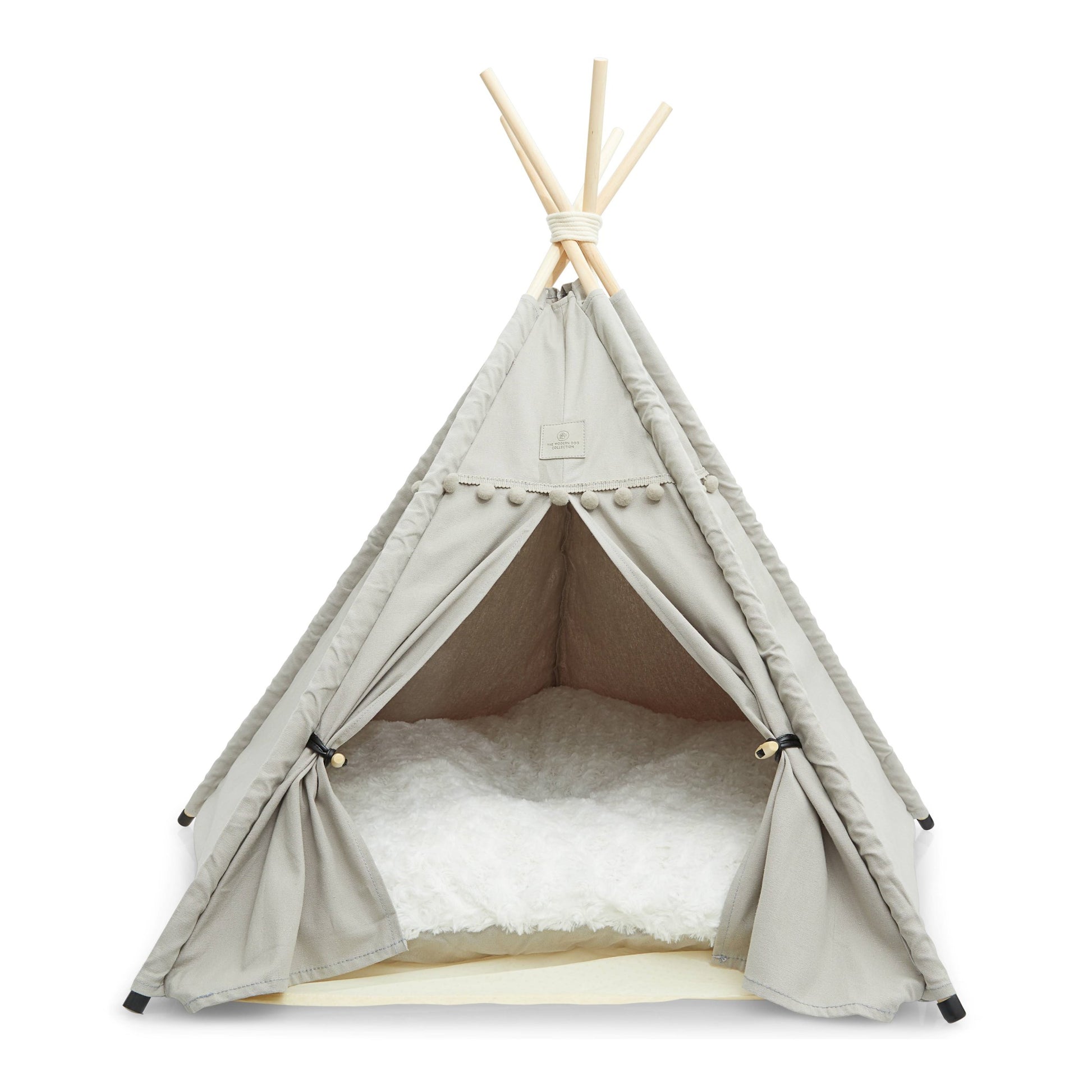 Denali teepee dog bed grey with thick, soft cushion, floor protectors, wooden poles, and tieback curtains.